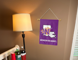 purple northwestern state university garden flag hanging on banner pole inside living room