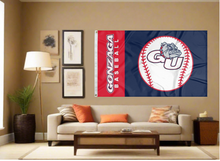 Load image into Gallery viewer, Blue and red 3x5 Gonzaga Baseball flag with two metal grommets covering tan wall of well lit room for sports décor
