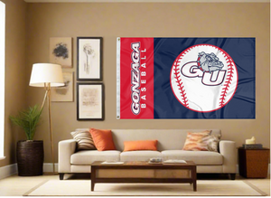 Blue and red 3x5 Gonzaga Baseball flag with two metal grommets covering tan wall of well lit room for sports décor