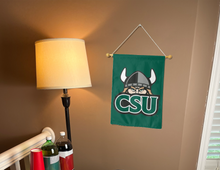 Load image into Gallery viewer, green cleveland state university garden flag hung from banner pole inside living room
