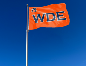 Orange 3x5 foot wide Auburn University Flag with War Damn Eagle WDE Logo and Two Metal Grommets attached to flagpole waving in the wind