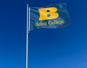 Blue 3x5 foot wide Beloit College Flag with two metal grommets attached to flagpole waving in the wind
