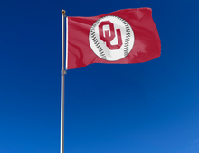 Load image into Gallery viewer, Red 3x5 University of Oklahoma Sooners Baseball Flag and Two Metal Grommets for outdoor home decor attached to flagpole waving in the wind
