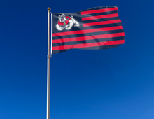 Load image into Gallery viewer, Fresno State University Flag with seven navy stripes and six red stripes and two metal grommets for indoor home décor attached to flagpole waving in the wind
