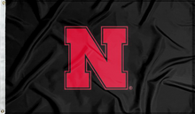 Load image into Gallery viewer, Black three by five foot University of Nebraska Applique Flag with two metal grommets
