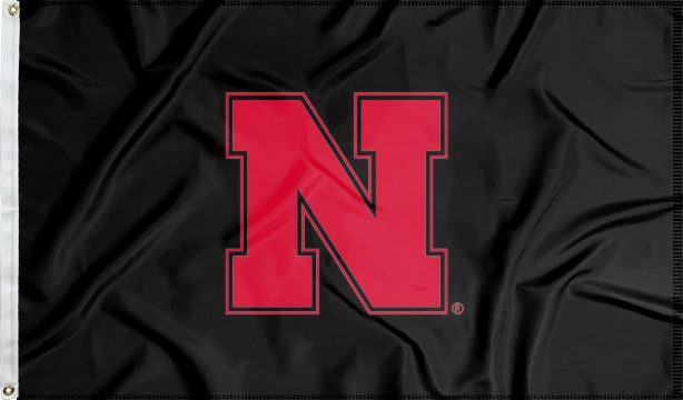 Black three by five foot University of Nebraska Applique Flag with two metal grommets