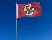 Load image into Gallery viewer, Red 3x5 foot wide Boston College Flag with two metal grommets attached to flagpole waving in the wind
