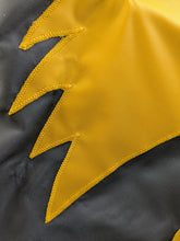 Load image into Gallery viewer, Close-up of a section of a gold and black University of Iowa National Applique flag, showing the detailed stitching and fabric texture.
