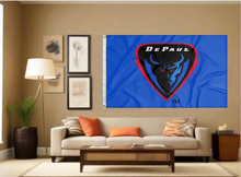 Load image into Gallery viewer, Blue 3x5 foot wide DePaul University Flag with DePaul Demon Head logo and two metal grommets covering the tan wall of a living room
