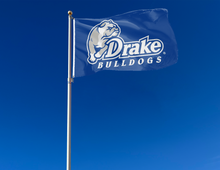 Load image into Gallery viewer, Blue 3x5 foot wide Drake University Bulldogs Flag with two metal grommets attached to flagpole waving in the wind
