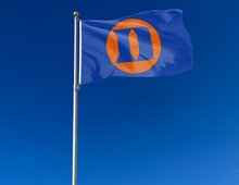 Load image into Gallery viewer, Blue Duke University 3x5 Flag with D Logo and Basketball Logo and two metal grommets attached to flagpole waving in the wind
