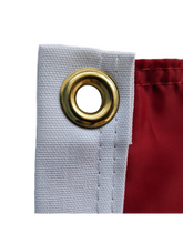 Load image into Gallery viewer, Gold Metal grommet of Red University of Nebraska Applique Flag
