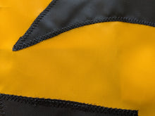 Load image into Gallery viewer, Close-up shot of Iowa hawkeyes logo sewn on gold university of iowa applique flag
