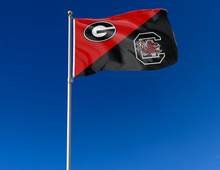 Load image into Gallery viewer, red and black Georgia South Carolina house divided flag attached to flagpole waving in the wind
