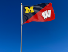 Load image into Gallery viewer, blue and red Michigan Wisconsin House divided flag attached to flagpole waving in the wind

