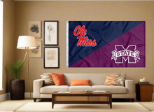 Load image into Gallery viewer, blue and maroon house divided Ole Miss Mississippi State Game flag covering living room wall
