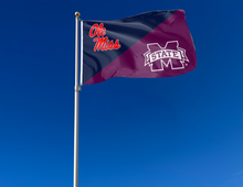 Load image into Gallery viewer, blue and maroon house divided Ole Miss Mississippi State Game flag attached to flagpole waving in the wind
