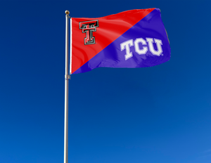red and purple Texas Tech TCU house divided flag attached to flagpole waving in the wind