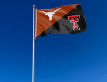 Load image into Gallery viewer, orange and black Texas Texas Tech Rivalry House Divided Flag attached to flagpole waving in the wind
