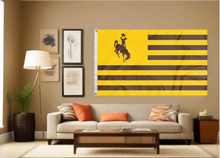 Load image into Gallery viewer, American flag style University of Wyoming flag hung inside college dorm as part of man cave decor
