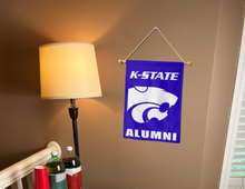 Load image into Gallery viewer, purple K-State Alumni Garden Flag hung inside for man cave decor
