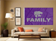 Load image into Gallery viewer, Purple 3x5 foot wide Kansas State University flag with grey Family logo and two metal grommets covering the tan wall of a well-lit room

