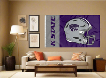 Load image into Gallery viewer, 3x5 foot wide Kansas State University Football Flag with two metal grommets covering the tan wall of a well-lit room
