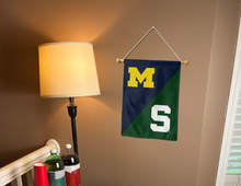 Load image into Gallery viewer, michigan msu rivalry house divided garden flag hung inside a college dorm
