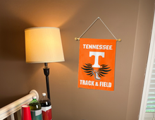 Load image into Gallery viewer, Tennessee Track &amp; Field garden flag hung inside a dorm for man cave decor
