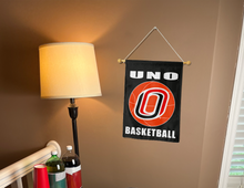 Load image into Gallery viewer, indoor display of UNO basketball garden flag for man cave decor
