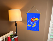 Load image into Gallery viewer, university of Kansas garden flag hanging on banner pole inside living room
