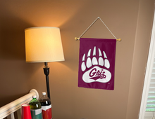 Load image into Gallery viewer, Montana garden flag with Griz Paw logo hung inside a college dorm
