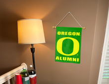 Load image into Gallery viewer, University of Oregon Alumni Garden Flag displayed for man cave decor
