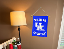 Load image into Gallery viewer, this is Kentucky wildcats country garden flag hung inside for dorm decor
