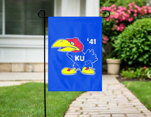 University of Kansas garden flag hung outside with 1941 Jayhawk logo