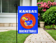 Load image into Gallery viewer, kansas basketball garden flag displayed outdoors on a garden flag stand
