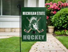 Load image into Gallery viewer, Michigan State hockey garden flag hung on a garden flag stand for yard decor
