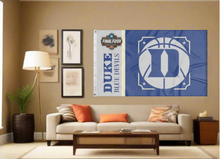 Load image into Gallery viewer, blue and grey Duke Basketball Men&#39;s Final Four 3x5 Flag for indoor home décor covering tan wall of well-lit room
