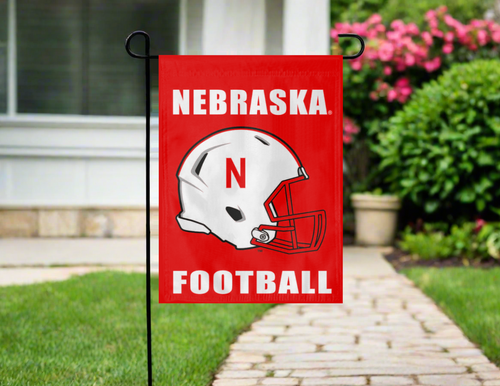 red nebraska football garden flag hung outside from stand