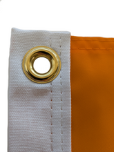 Load image into Gallery viewer, Close-up shot of gold grommet on an orange University of tennessee applique flag
