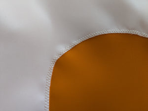 close-up of white Tennessee T logo sewn on orange University of Tennessee applique flag