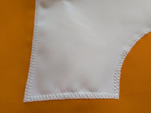 Load image into Gallery viewer, close-up of white Tennessee T logo sewn on orange University of Tennessee applique flag
