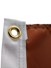 Load image into Gallery viewer, close up of gold metal grommet on an orange university of texas longhorns applique flag
