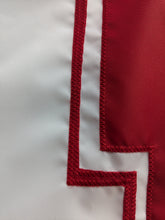 Load image into Gallery viewer, Red N logo sewn onto White three by five foot wide University of Nebraska Lincoln Applique flag with two metal grommets 
