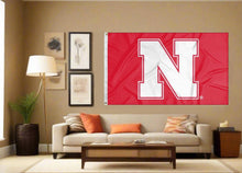 Load image into Gallery viewer, Red Nebraska Huskers Flag attached to flagpole waving in the wind
