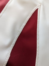 Load image into Gallery viewer, Close-up of the Alabama University A logo hand-sewn onto an applique flag with white zig zag technique
