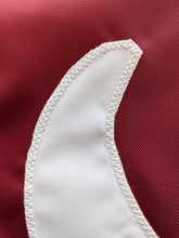 Load image into Gallery viewer, Close-up of the Alabama University A logo hand-sewn onto an applique flag with white zig zag stitches
