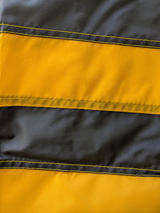 Gold and black hand-sewn stripes of University of Iowa National Applique Flag, showing detailed stitching