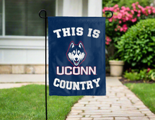 Load image into Gallery viewer, this is UCONN country garden flag hung outside for yard decor
