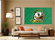 Load image into Gallery viewer, Green University of Oregon flag with Oregon Duck logo hung inside the living room
